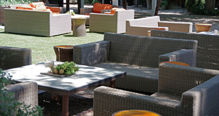 Sectional view of an arrangement of outdoor seating furniture waiting for the weekend guests