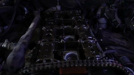 Engine block underneath a car hood.