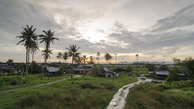 Timelapse sunset at small local Malays kampung house 