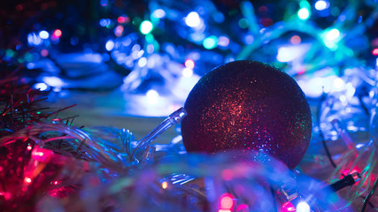 Christmas colorful New Year's Bokeh neon lights. Abstract Blurred photo background with blinking...