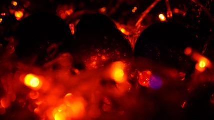 Christmas colorful New Year's Bokeh neon lights. Abstract Blurred photo background with blinking...