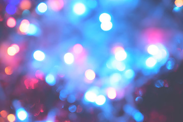 Christmas colorful New Year's Bokeh neon lights. Abstract Blurred photo background with blinking...