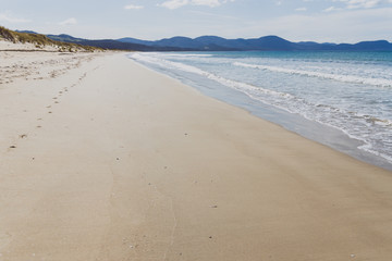 sunny pristine and deserted beach overlooking the South Pacific Ocean