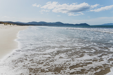 sunny pristine and deserted beach overlooking the South Pacific Ocean