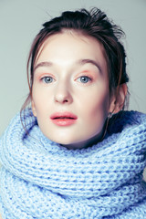 beauty young blond woman in scarf with weathered lips close up isolated, dehydrated winter skin cosmetic concept