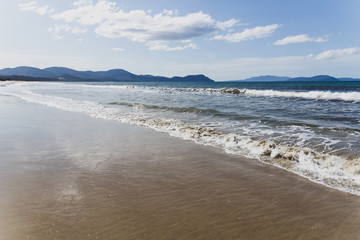 sunny pristine and deserted beach overlooking the South Pacific Ocean