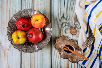 Shofar and tallit with glass honey and fresh ripe apples. Jewish new year symbols. Rosh hashanah