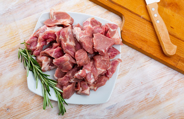 Raw pork neck meat cuts, top view on wooden background
