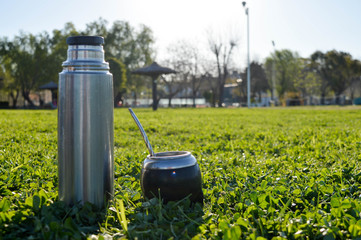 thermos and mate on green grass