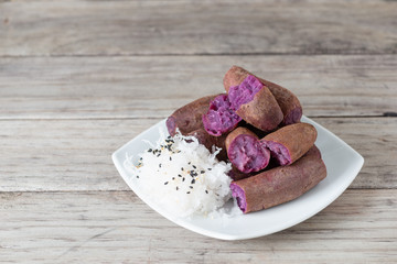 Steamed purple sweet potato in white plate
