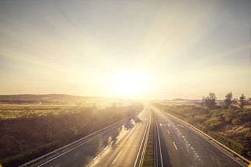 Sunset on straight country road