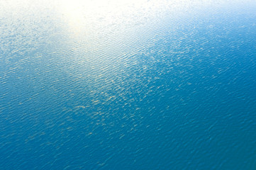 Abstract blur image of aerial view from drone of clear water are beautiful in the spring season, natural blue texture background.