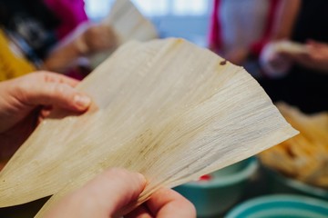 woman cutting dough in kitchen