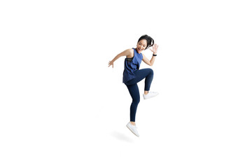 Asian woman is jumping and exercising - obrazy, fototapety, plakaty