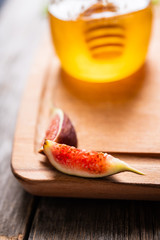 Figs slice on the wooden cutting board. Selective focus. Shallow depth of field.