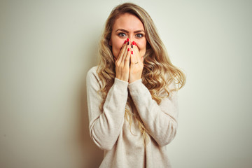 Beautiful woman wearing winter turtleneck sweater over isolated white background laughing and...