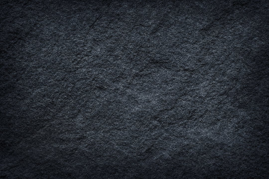 Dark grey stone / black slate stone background or texture © prapann