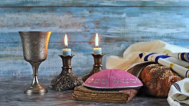 Shabbat challah bread, shabbat wine and candles on the table Jewish Holiday