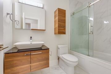 Interior design of a modern bathroom in a newly built house or apartment, hotel room.