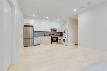 Interior design of a classic living room with kitchen in the newly built house or apartment, basement for rent.