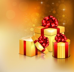 Golden open gift boxes with red bow and ribbon