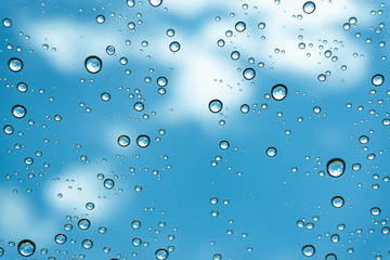 Rain on the window, natural skin of the rain The natural form of rainwater on a sky background.