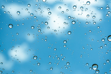 Rain on the window, natural skin of the rain The natural form of rainwater on a sky background.