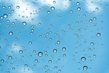 Rain on the window, natural skin of the rain The natural form of rainwater on a sky background.