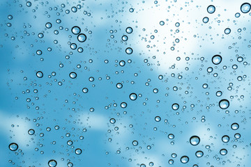 Rain on the window, natural skin of the rain The natural form of rainwater on a sky background.