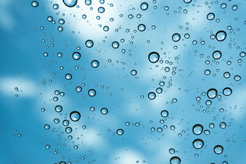 Rain on the window, natural skin of the rain The natural form of rainwater on a sky background.