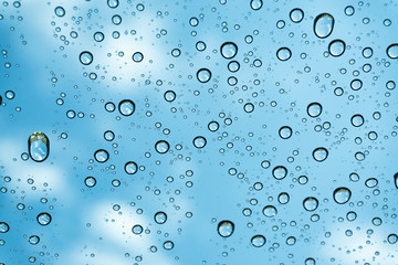 Rain on the window, natural skin of the rain The natural form of rainwater on a sky background.