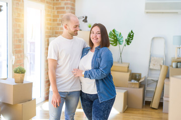 Young couple together smiling happy moving to a new house