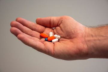 Hand holding pills