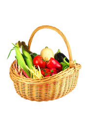 new picked fresh vegetables in basket isolated on white background