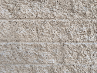 texture of a tan brick wall, background