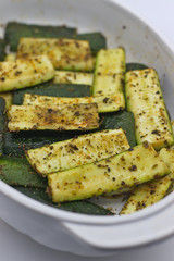 Baked zucchini with herbs and olive oil.