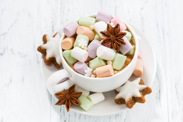 cocoa with colorful marshmallows and Christmas cookies, top view