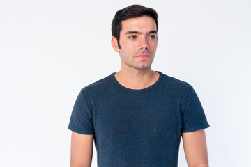 Fototapeta premium Face of young handsome Persian man thinking