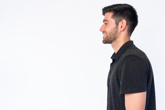 Closeup Profile View Of Happy Young Bearded Persian Man Smiling