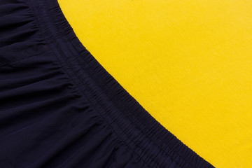 yellow cotton and blue synthetic fabric