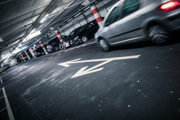 Fototapeta premium Underground parking/garage (shallow DOF; color toned image)