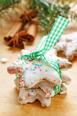 Christmas cookies in star shape on wooden table.