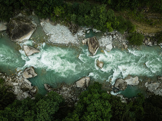 Aerial top view of a splendid mountain river in Swiss Alps