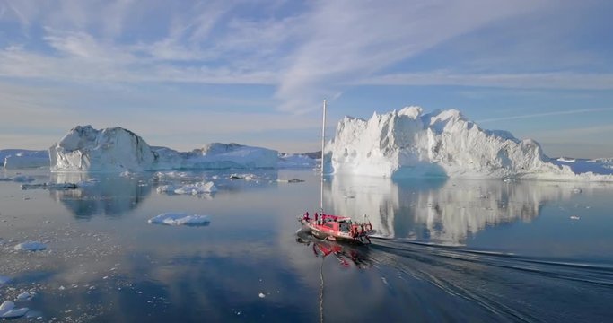 Aerial Forward: Boat Among Amazing Icebergs on a Sunny Day, Disko Bay, Greenland