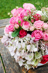 Beautiful floral arrangement with pink roses, hortensia and gypsophila paniculata