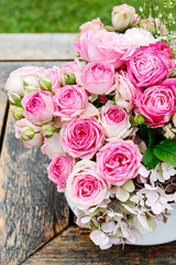 Beautiful floral arrangement with pink roses, hortensia and gypsophila paniculata