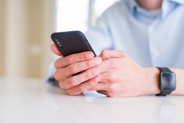 Close up of business man working using smartphone