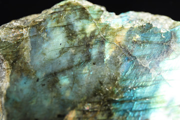 Beautiful labradorite gemstone on black background, closeup