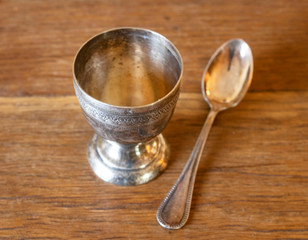 silver egg cup and egg