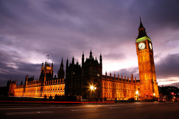 Fototapeta na wymiar Night view of Westminster Palace over dramatic cloudy sky
